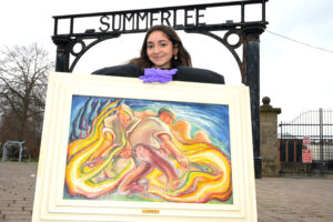 Neha Sayeed pictured with painting by Amelia Frood