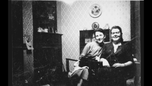 photograph of two women sitting in a chair